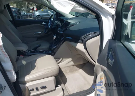 2016 Ford Escape Titanium z USA, uszkodzony, nr VIN 1FMCU0J99GUC66498